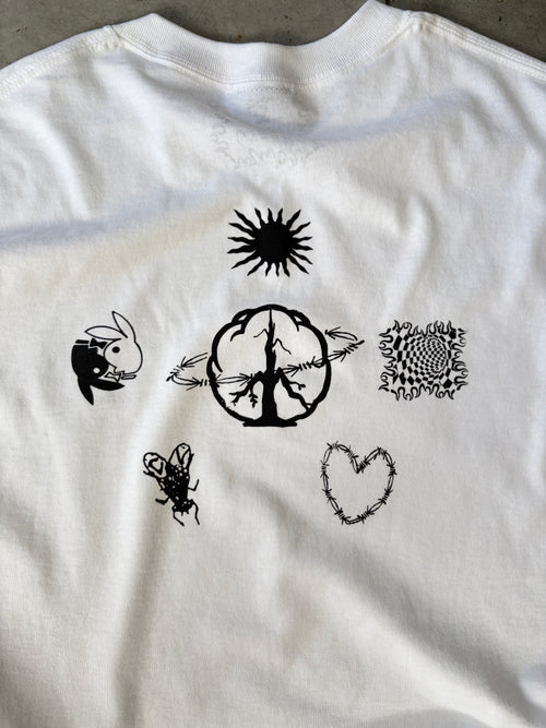 White t-shirt with black abstract designs including a sun, brain, rabbit, fly, heart, and intricate pattern on the back.