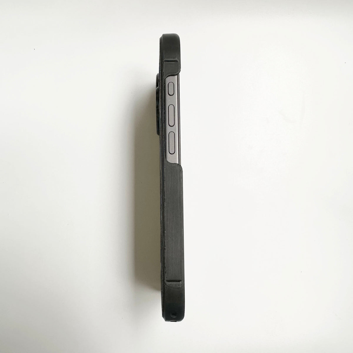 Side profile of a black spiderweb iPhone case showing its slim edge