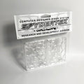 Two transparent skateboard riser pads with a web-like pattern in clear packaging, labeled "SPYDERTEK" at the top.