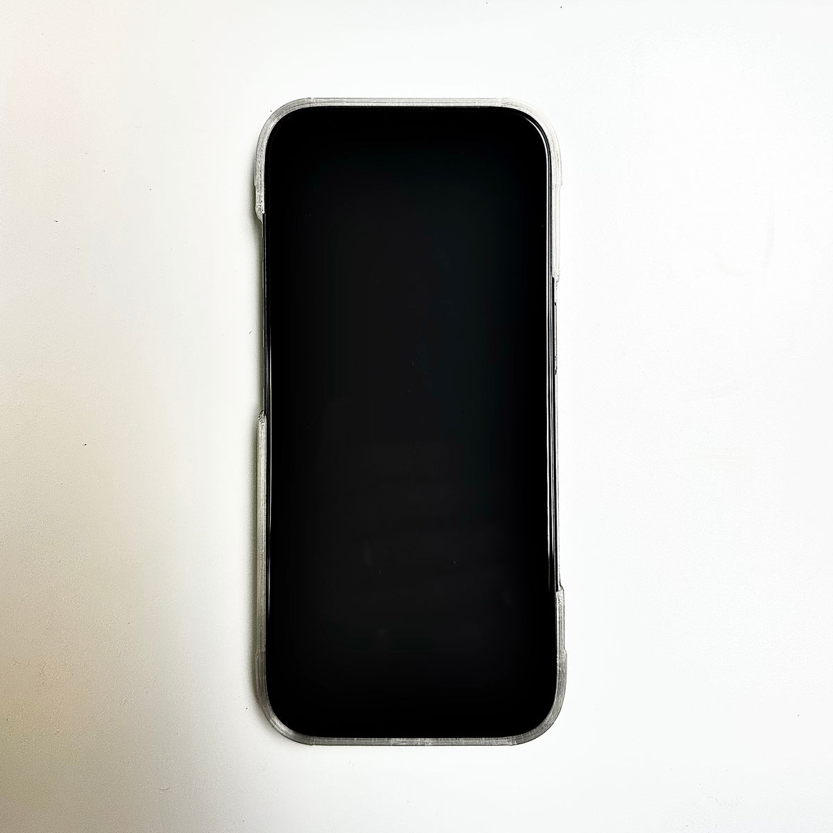 Front view of an iPhone in a clear snap case with the screen off
