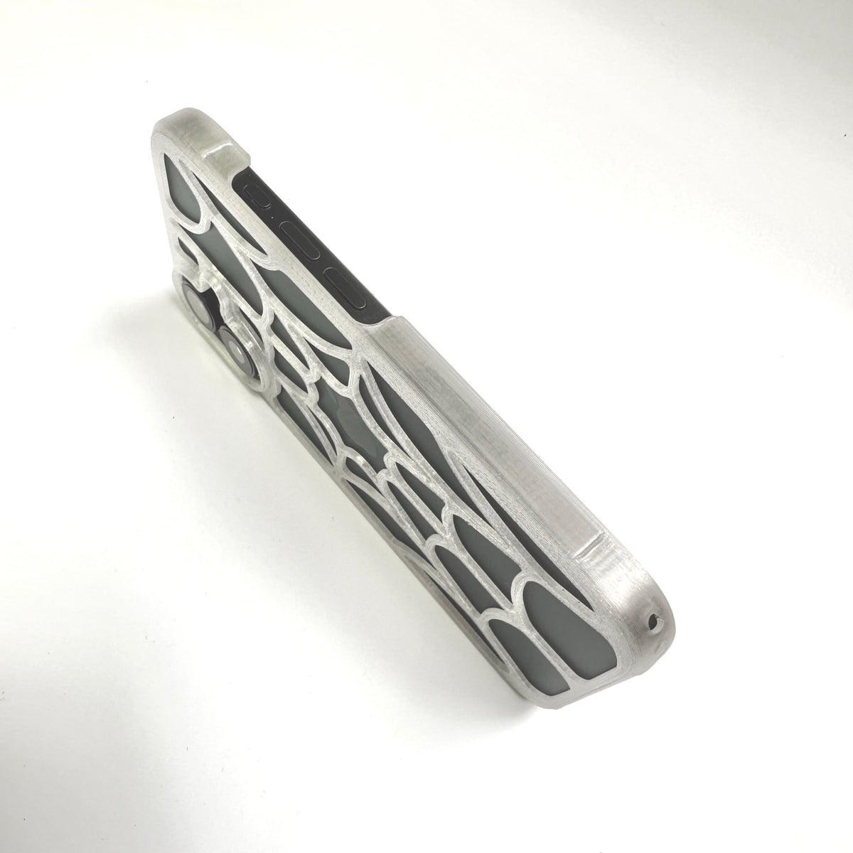 Side edge of a clear spiderweb iPhone case showing the web pattern